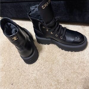 CHANEL Black Combat Boots with Gold Accents